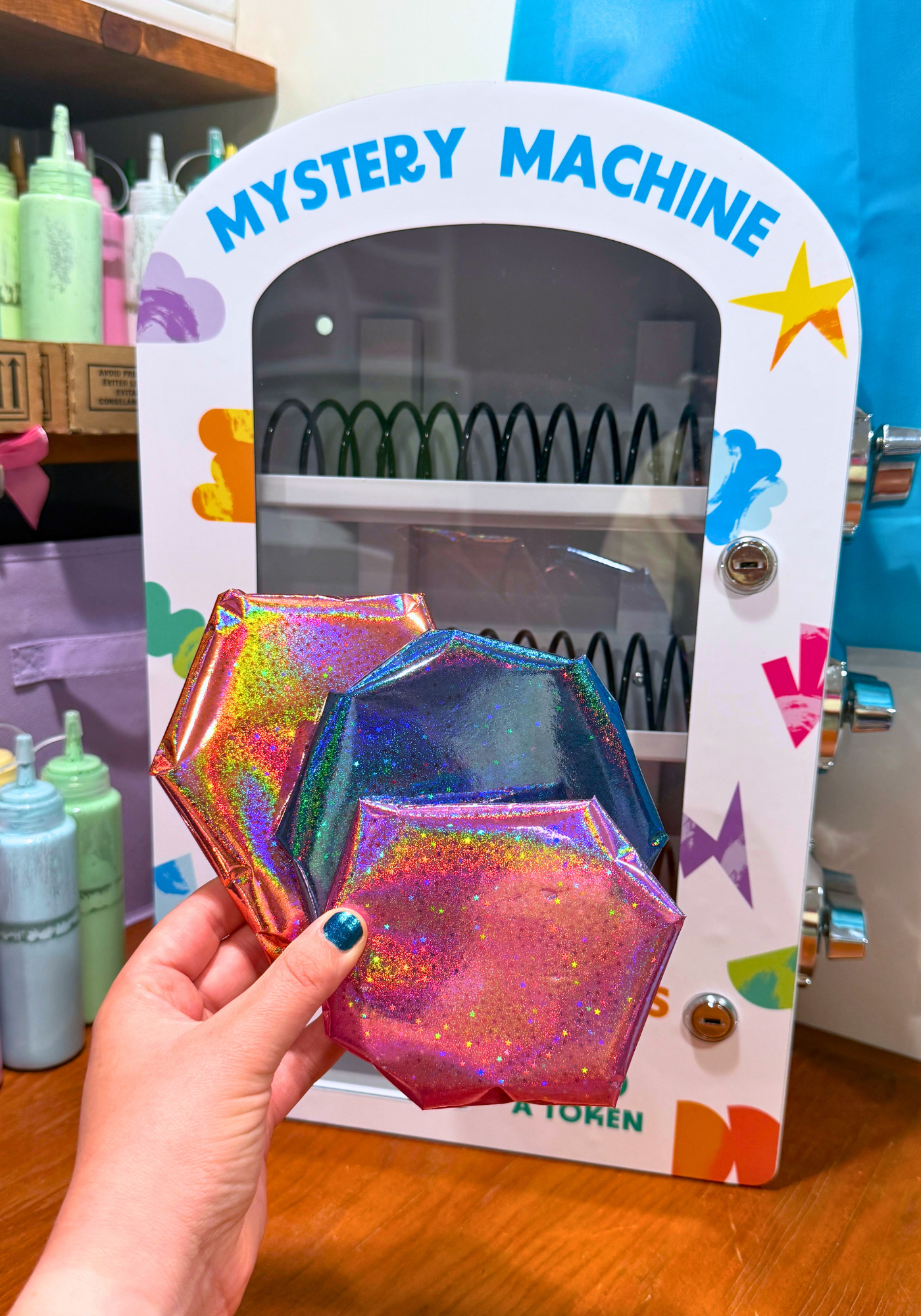 Mini vending machine with holographic wrapped mug rugs