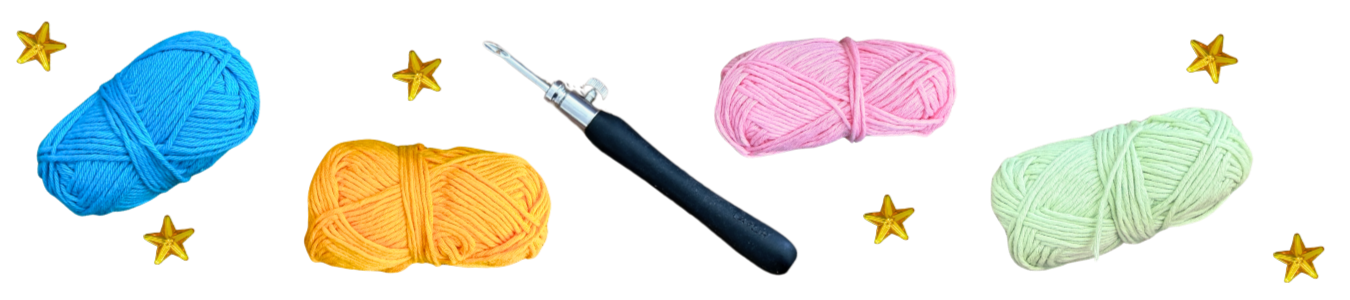 Punch needle surrounded by colorful yarn and star gems