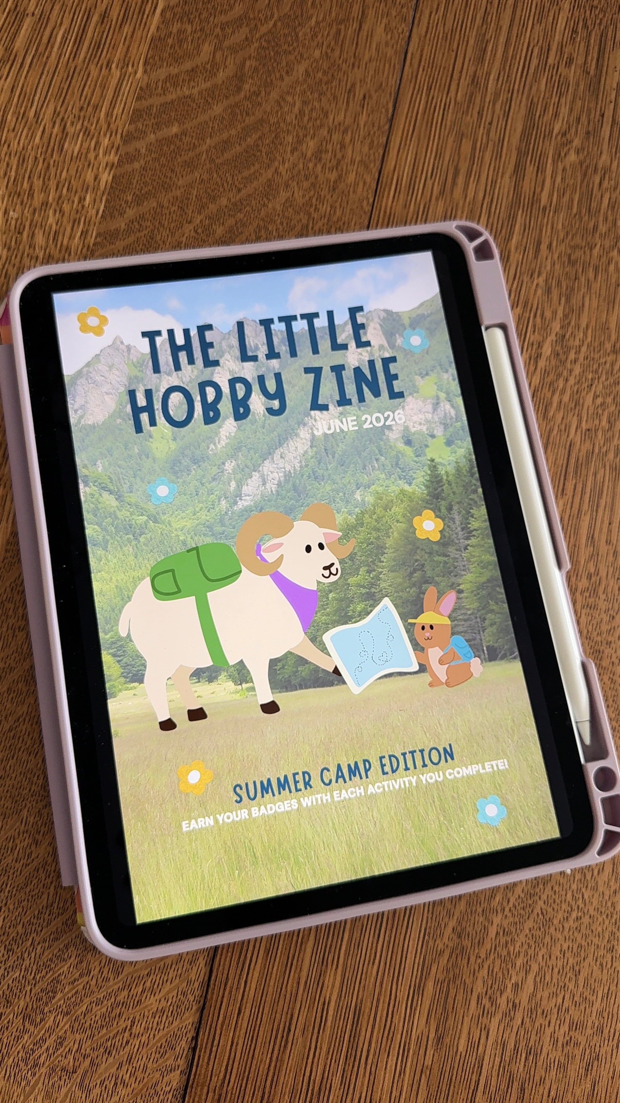 Tablet displaying 'The Little Hobby Zine' on a wooden surface