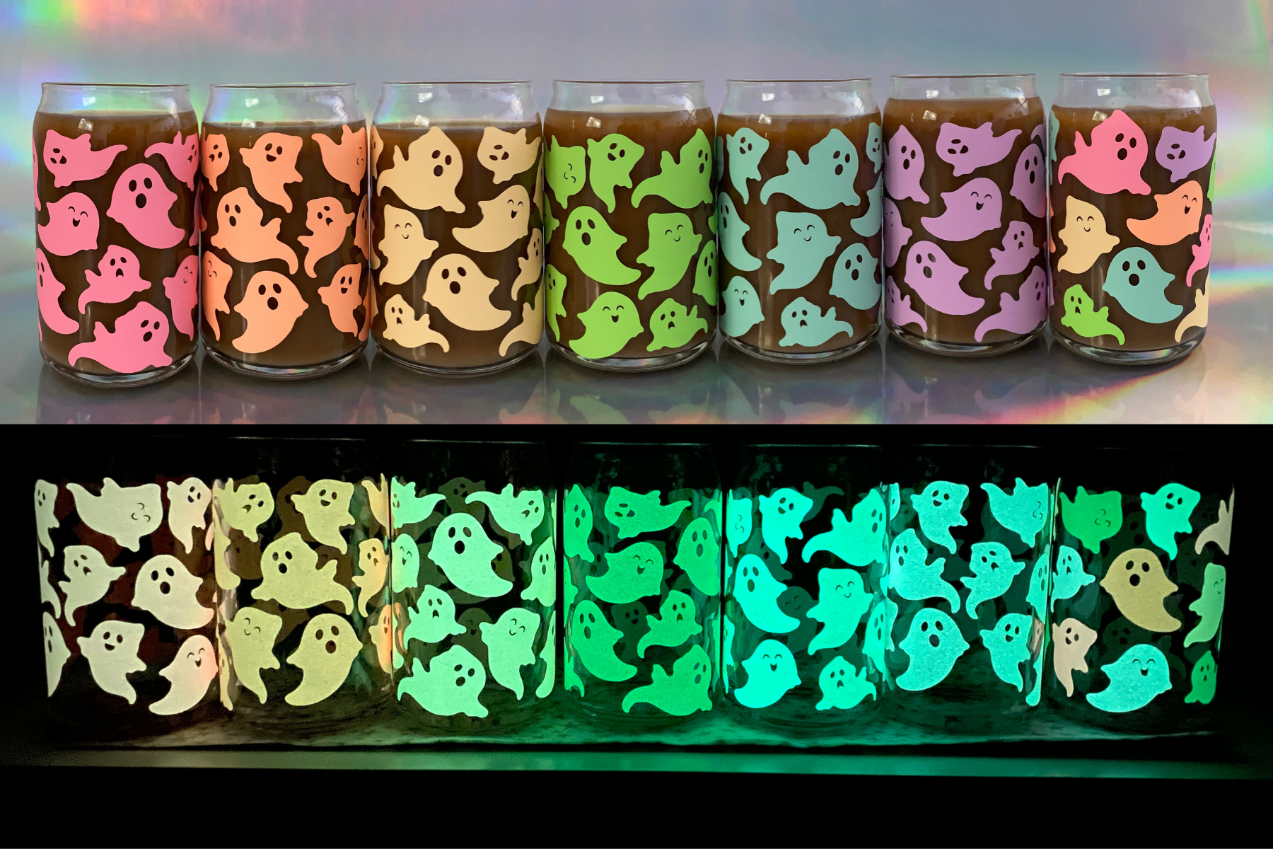 Glass cans covered in pastel rainbow ghosts in natural light and in their glow state on a able.